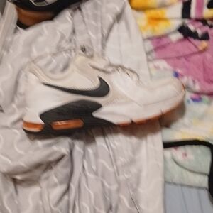 Nike White and Black Athletic Shoes with Orange Soles